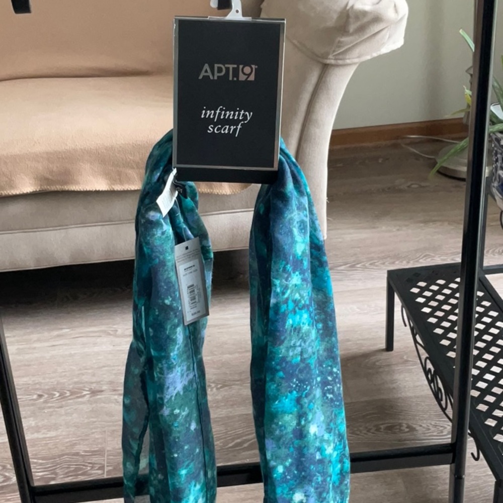 Infinity scarf with blue and green tones.